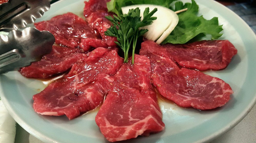 Marinated raw beef with egg yolk served on a plate